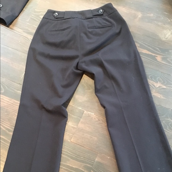 Black pant suit. Fitted jacket and straight leg pants with a slight boot cut. - Picture 5 of 10